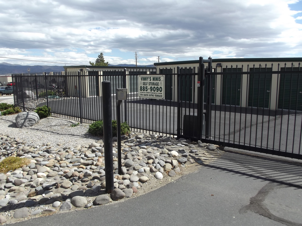 covered RV parking spots with large motorhomes under metal roof structure sunny day